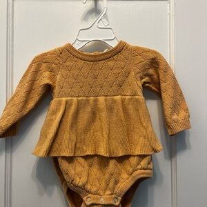 Kate Quinn peach colored onesie w ruffles